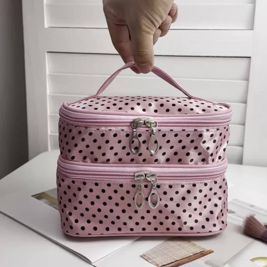 AuraNest double-layer makeup bag with pink polka dots, ideal for storing skincare products and makeup essentials.