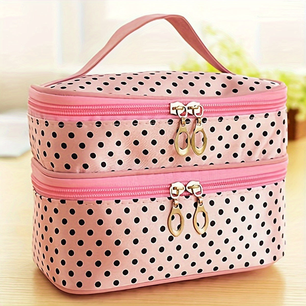 AuraNest double-layer makeup bag with pink polka dots, designed for skincare product storage and organization.